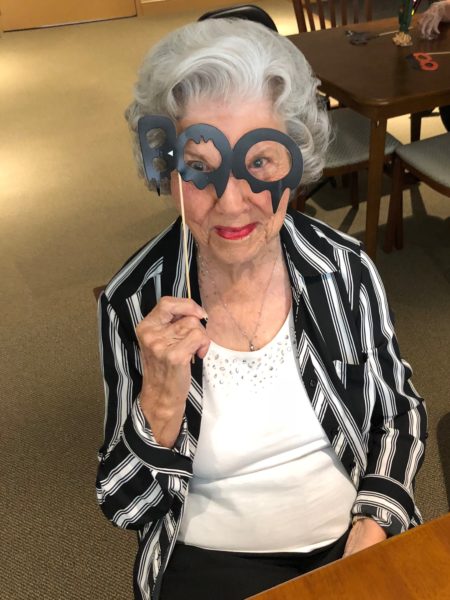 Halloween - a senior woman in a mask