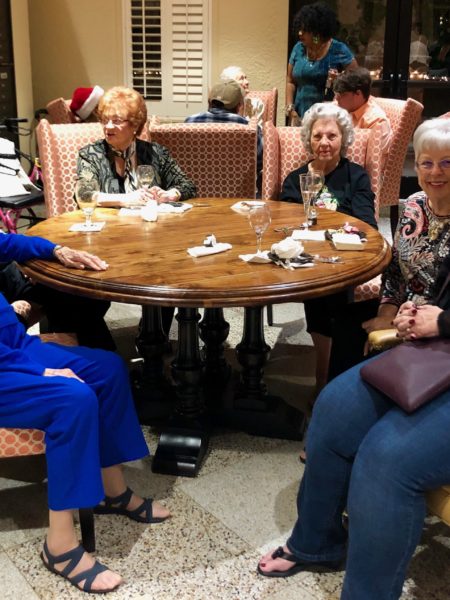 Holiday Party - a group of senior women sitting at a table